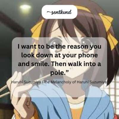 A person walks down a street, smiling at their phone while heading directly towards a lamppost.