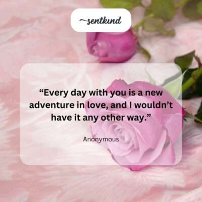 Two intertwined hearts with a winding road in the background.