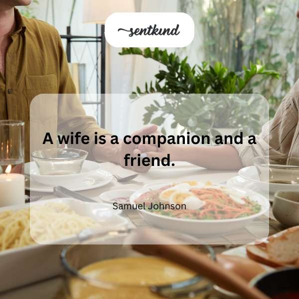 A woman is smiling while talking with a man, likely a husband and wife.
