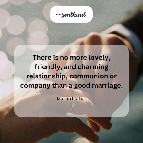 A happy couple holding hands while walking through a sunlit park.