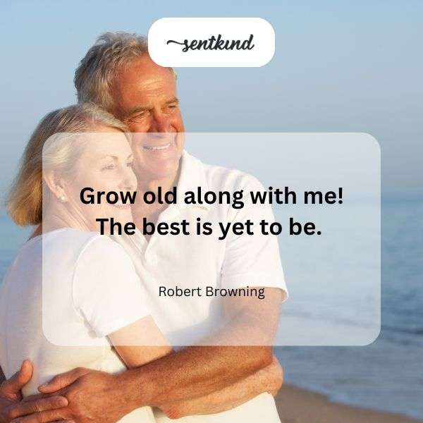 Elderly couple holding hands while walking through a sunlit garden.