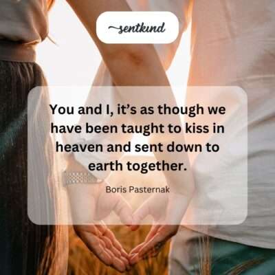 A couple embraces under a starry sky, their faces close as if about to kiss, symbolizing a celestial connection.