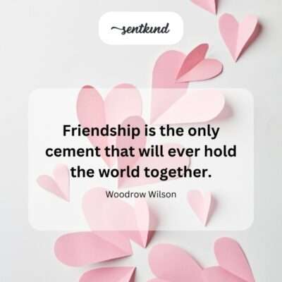 Diverse hands from different people linking together around a miniature globe, symbolizing global unity and connection.