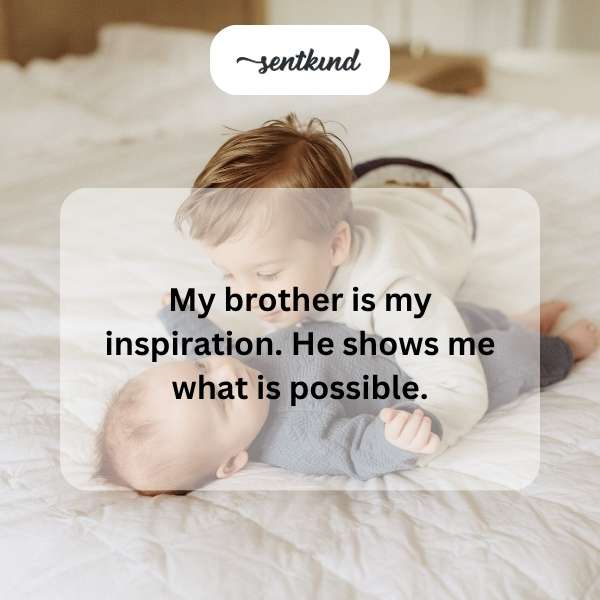 A young man smiles, looking towards his older brother.