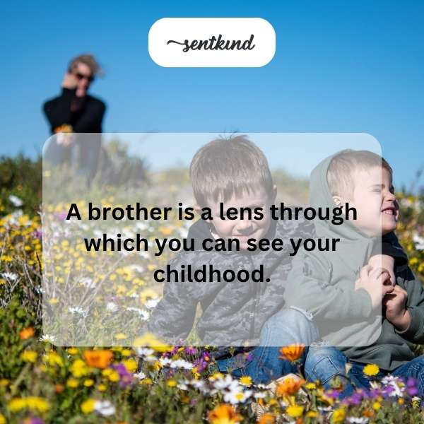 Two young brothers are looking through an old camera lens, playing together outdoors.