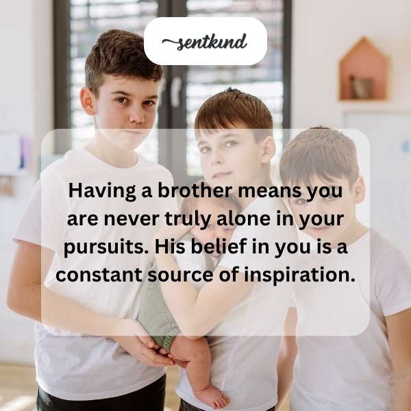 Two brothers are laughing together while hiking in the mountains, showcasing a strong bond.