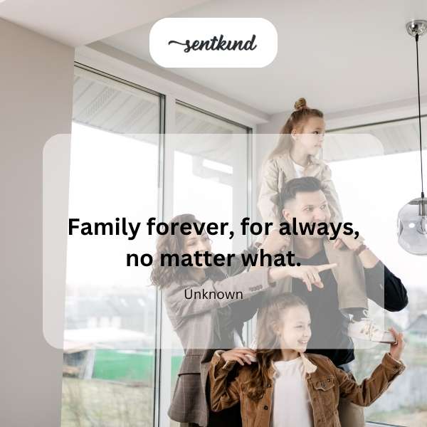 A group of diverse individuals of various ages are tightly embracing in a warm, loving family hug.