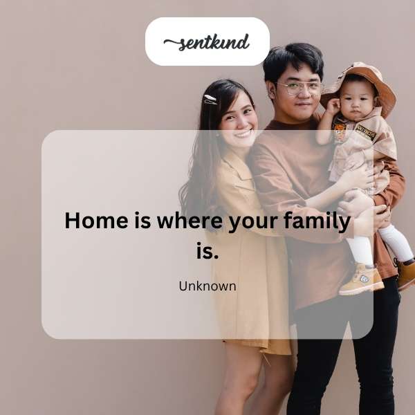 A multigenerational family laughs together in their brightly lit living room.