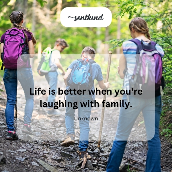 A family is joyfully laughing together during a meal.
