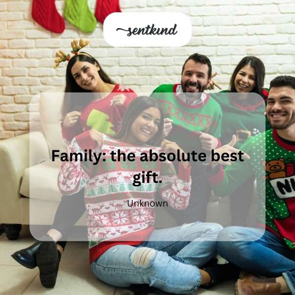 A warmly lit Christmas tree surrounded by a family opening gifts.
