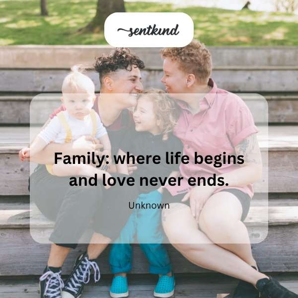 A multigenerational family is embracing tightly in a sunlit park.