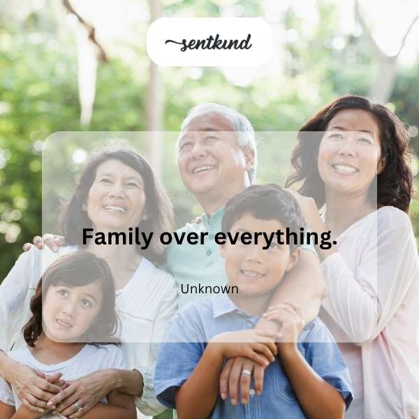 A group of diverse people are embracing affectionately, symbolizing familial bonds.