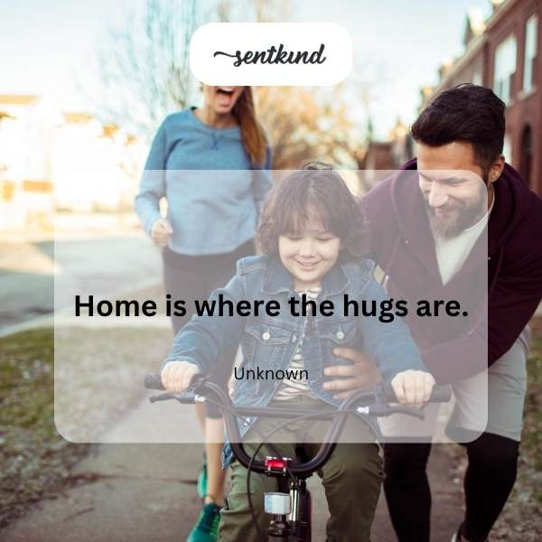 A warmly lit living room shows a family embracing, suggesting comfort and love.