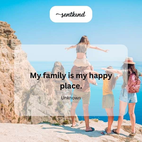 A smiling family is embracing in a sunlit park.
