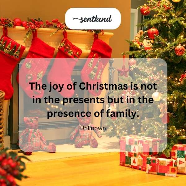 A warmly lit Christmas tree surrounded by a family opening presents.