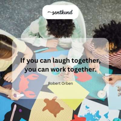 Team sharing a laugh during a meeting.