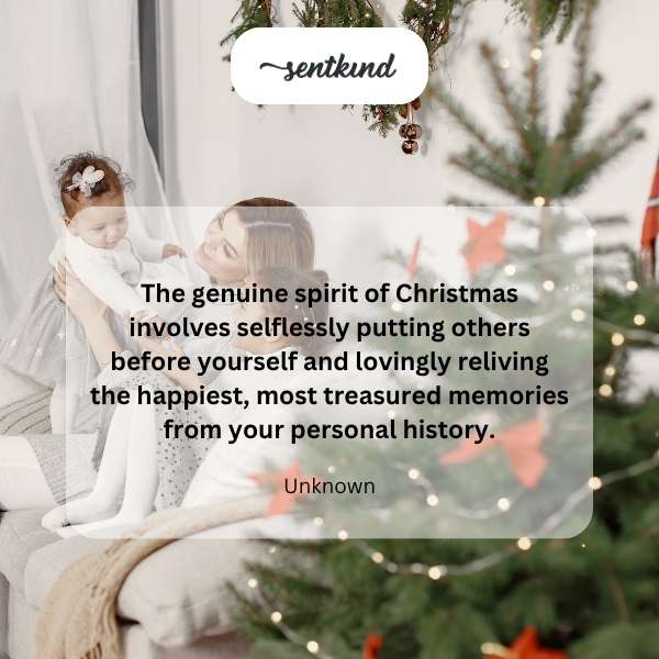 A warmly lit Christmas tree adorned with ornaments is the focal point of a cozy living room scene.