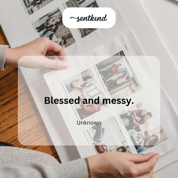 A cluttered desk with scattered papers, coffee cups, and a family photo.