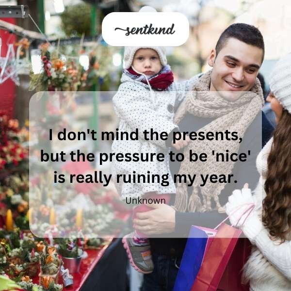 A person looks stressed while surrounded by holiday gifts.