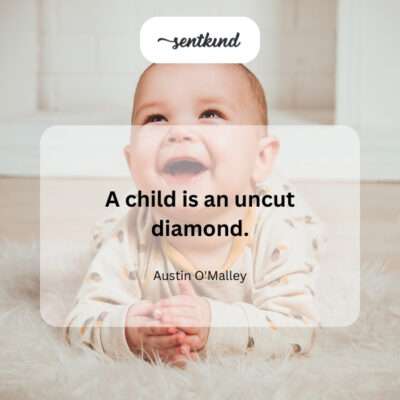 Rough diamond next to a child's hand.