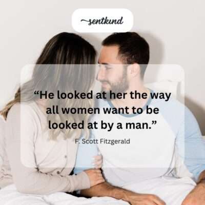 A man with soft eyes looks tenderly at a smiling woman.