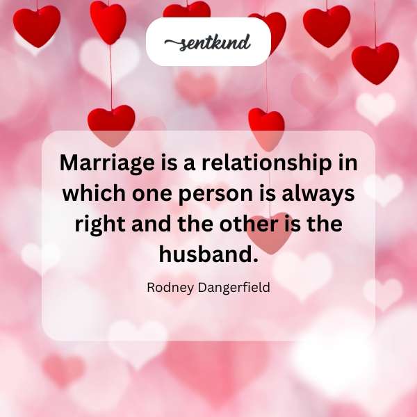 A husband playfully concedes an argument to his wife with a smile.