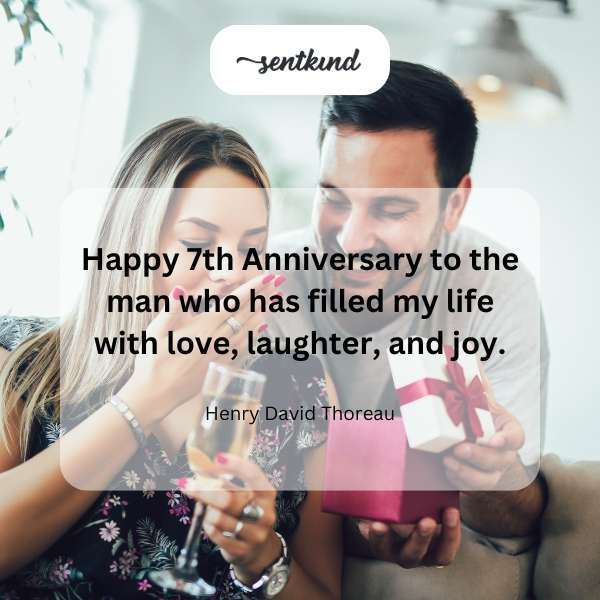 A couple embracing affectionately with a celebratory glow.