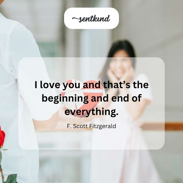 A couple embraces tenderly against a softly blurred background.
