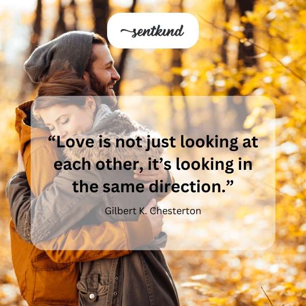A couple gazes towards a distant horizon, symbolizing shared goals.
