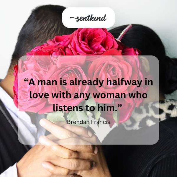 A woman attentively listens to a man speaking.