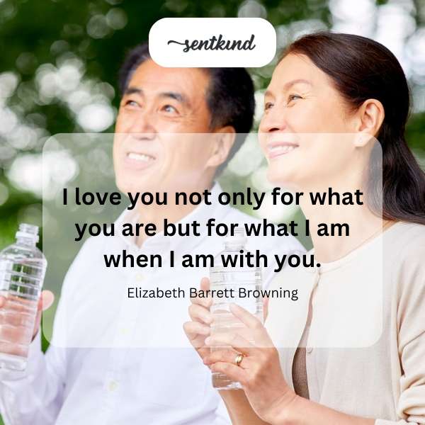 A couple is embracing in a sunlit field, symbolizing love and personal growth.