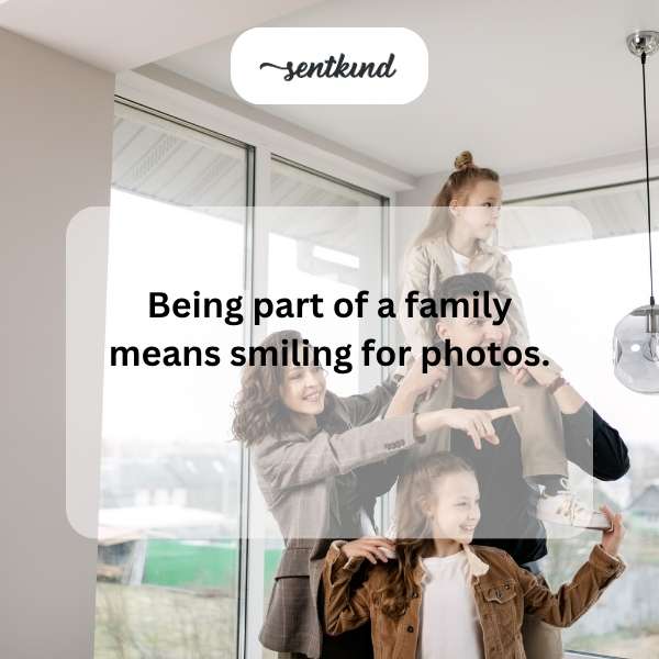 A group of diverse people are joyfully laughing and embracing each other, suggesting a close family bond.