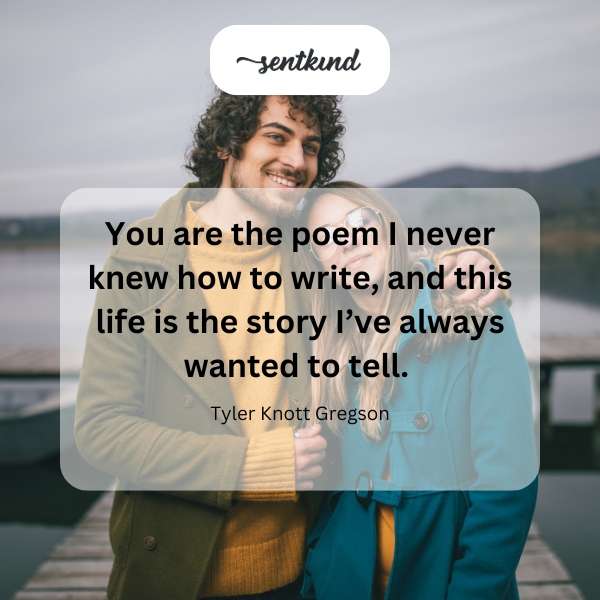 A person is writing in a journal, illuminated by soft, warm light.