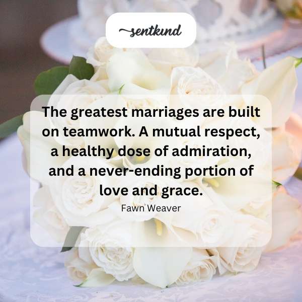 A wedding band set rests on a book about marriage.