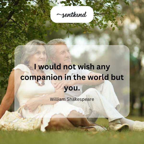A couple gazes lovingly at each other in a sunlit garden.