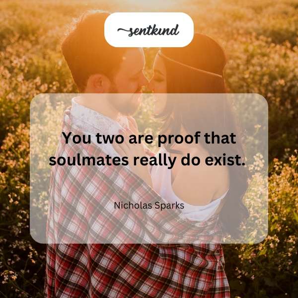 A happy couple embraces in a romantic setting.