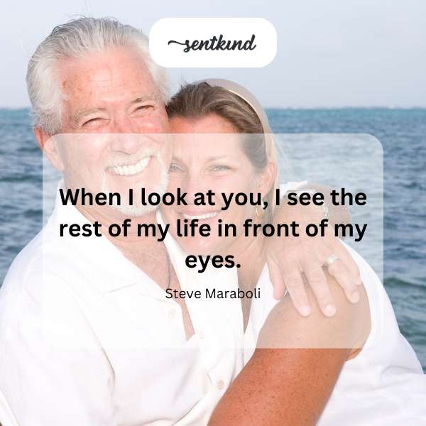 A couple gazes lovingly into each other's eyes.