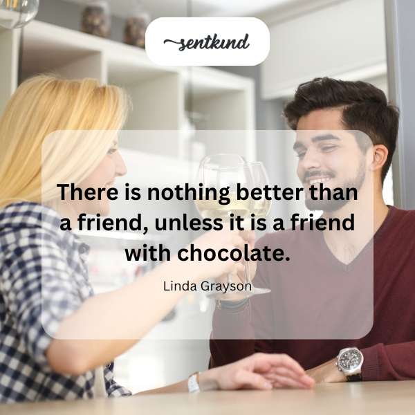 A smiling person offers another a chocolate bar.