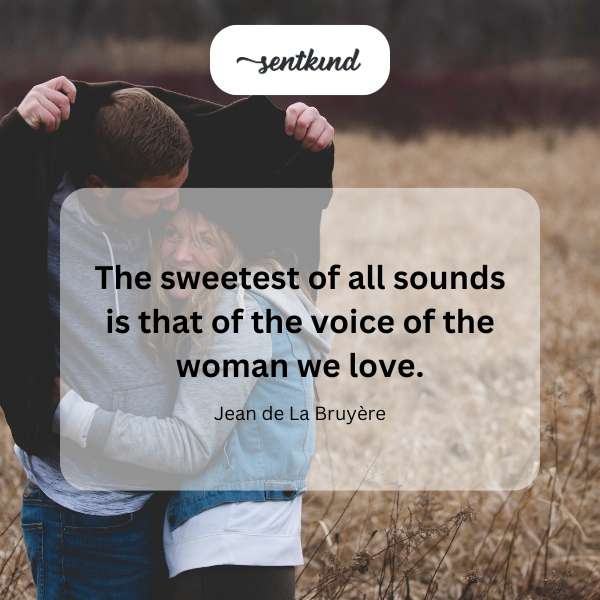 A woman is speaking softly, her expression tender and loving.
