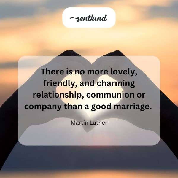 A couple smiles warmly at each other during their wedding ceremony.