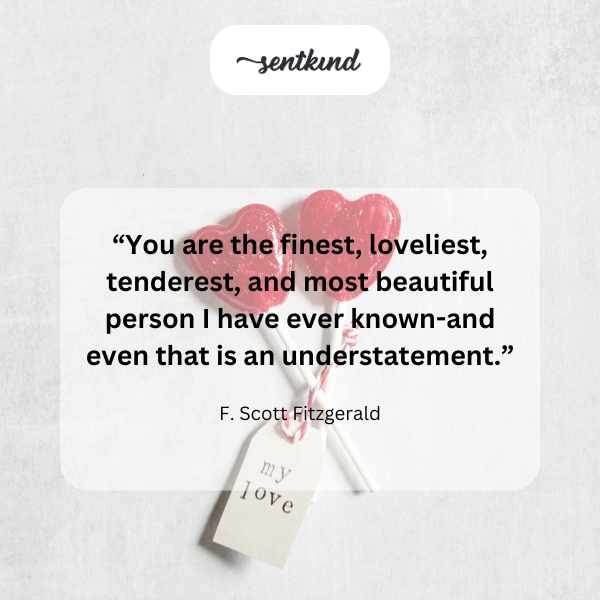A romantic quote overlaying a soft, blurred image of a couple embracing.