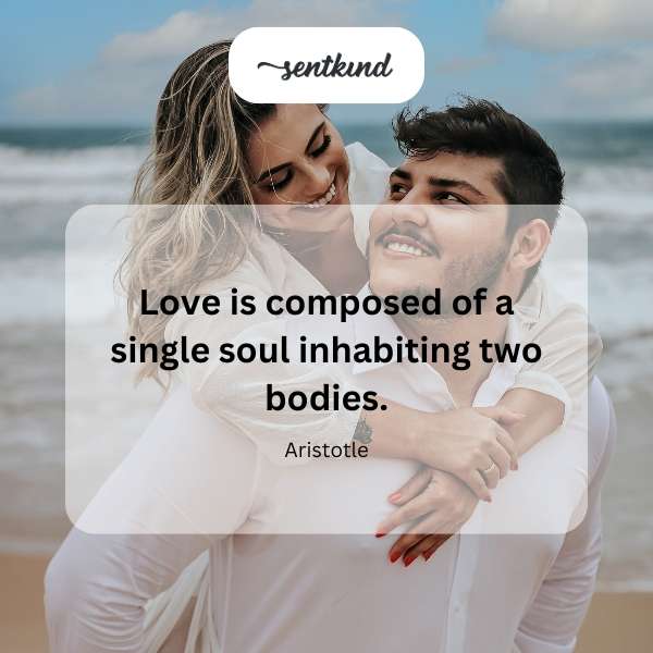 Two people embracing, forming a heart shape with their bodies.