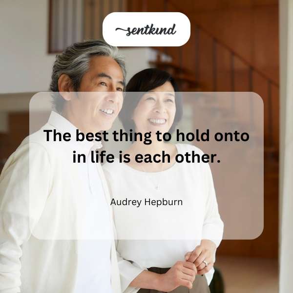 A close-up image shows two people holding hands, symbolizing connection and support.