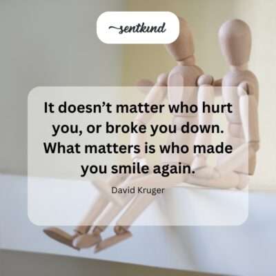 A close-up photo of a person smiling genuinely after appearing sad, symbolizing recovery and renewed happiness.