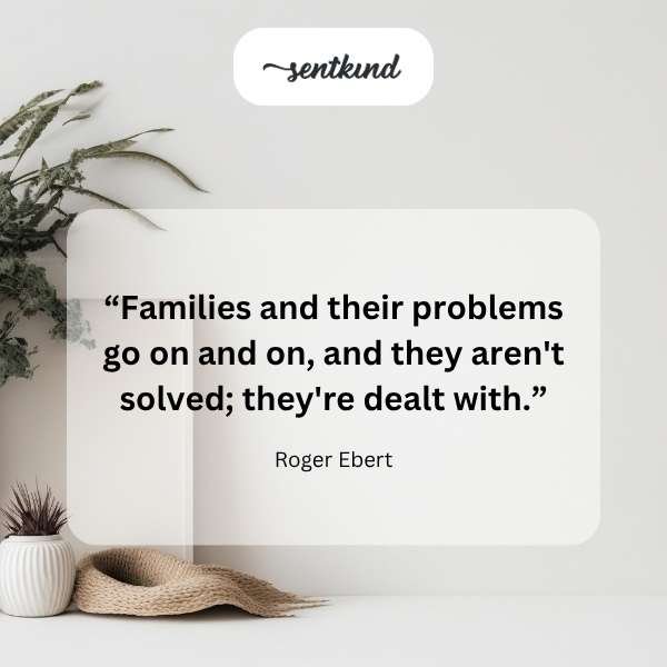 A young boy with a slight grimace stands up after falling, brushing dirt off his scraped knee.