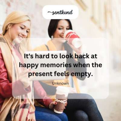 A person sits alone in a stark room looking down at a photograph, symbolizing the feeling of emptiness in the present compared to happier memories.