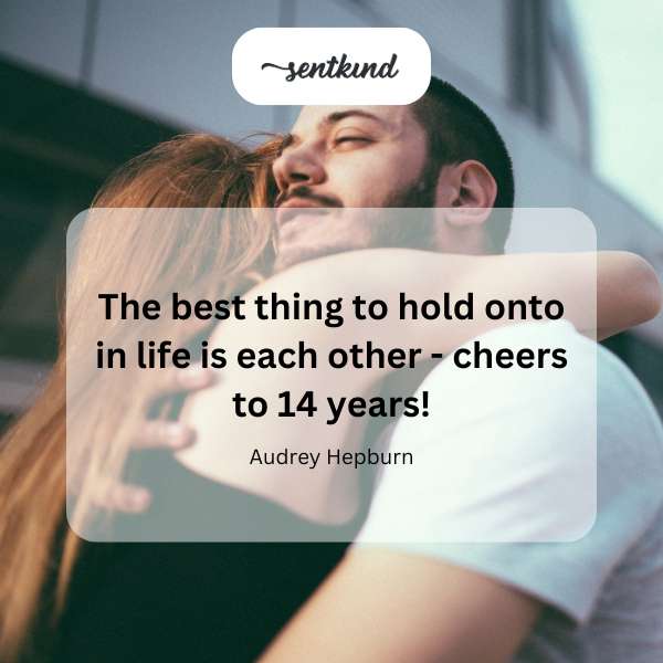 A couple embracing affectionately, celebrating their 14th anniversary.