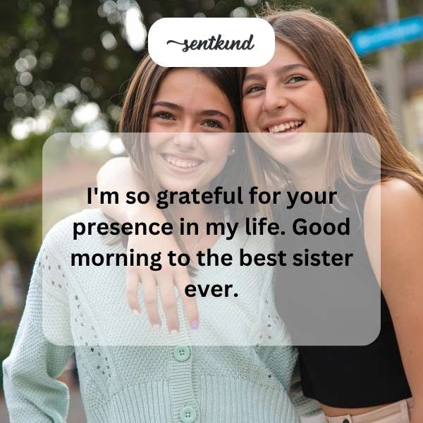 A smiling woman hugs another woman tightly, symbolizing sisterhood.
