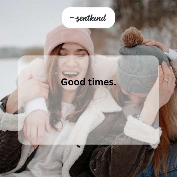 A group of smiling friends sharing a laugh while enjoying a casual outdoor picnic.