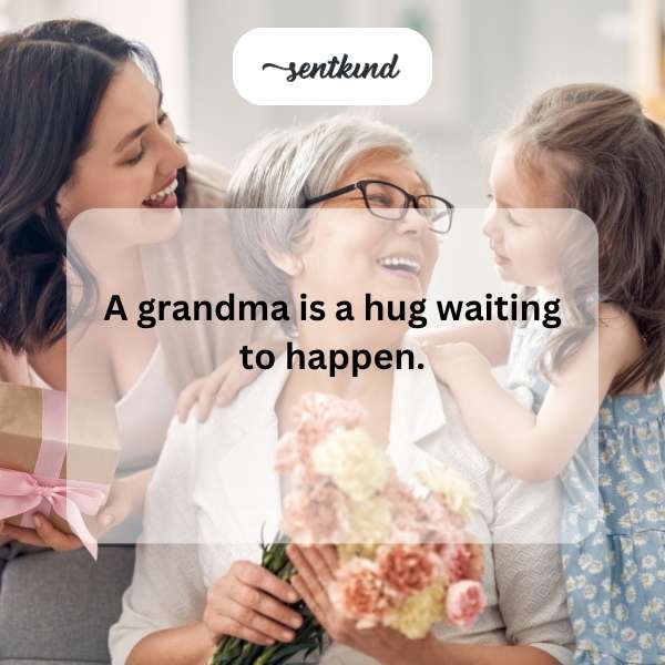 A smiling grandmother wraps her arms around a young grandchild in a warm embrace.